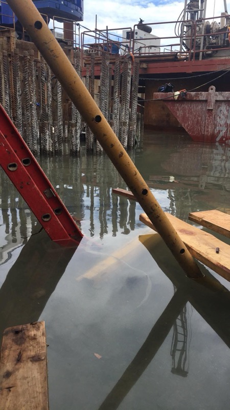 Pier construction site with heavy equipment